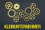 Zahnräder und Schriftzug Kleinunternehmer